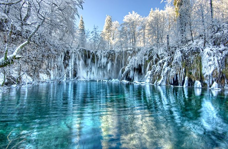 Winter landscape with snow-covered trees around Plitvice Lakes